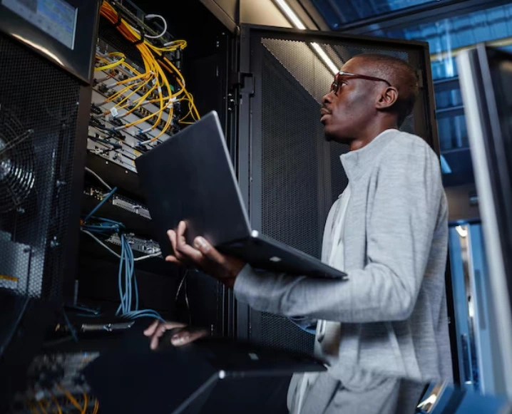 Image of an ICT technician performing upgrades